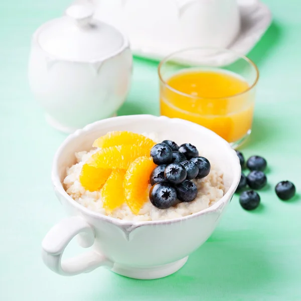 Rice milk pudding with oranges — Stock Photo, Image