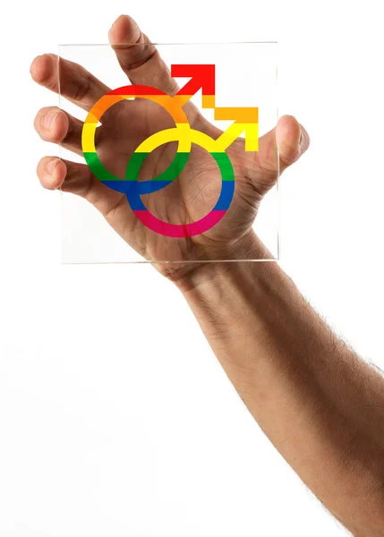 Hand hält Glas mit Homo-Ehe-Symbolen — Stockfoto