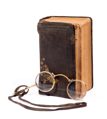 Vintage pince-nez glasses with an old book clipart
