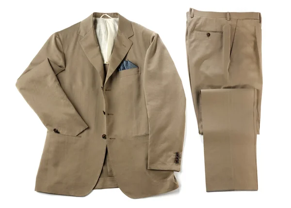 Beige kostym med prydligt vikta byxor och jacka — Stockfoto