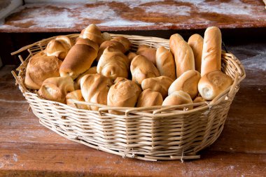 Wicker basket filled with fresh assorted rolls