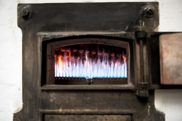 Burning jets in an old bakery oven — Stock Photo, Image