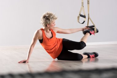 Woman placing training rings around feet