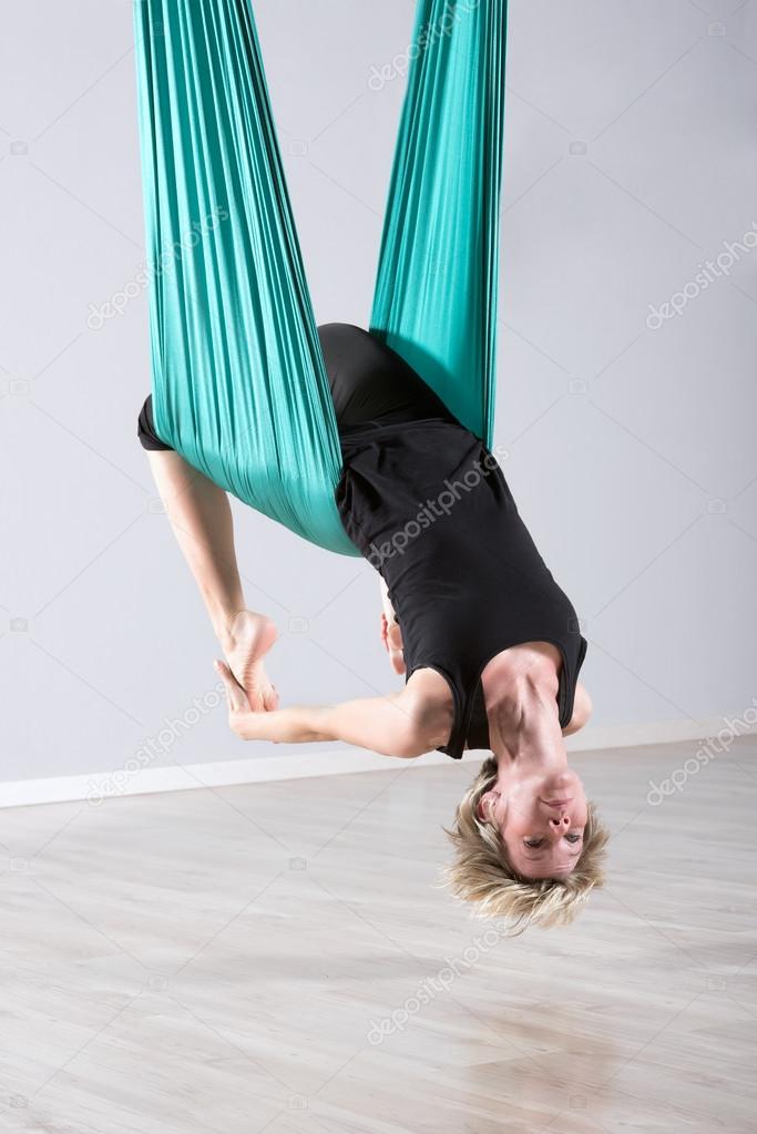 Upside Down Woman Doing Aerial Yoga Back Bends Stock Photo