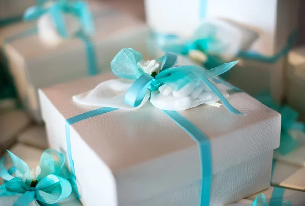 Decorative gift-wrapped party favor in a box — Stock Photo, Image