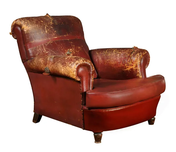 Aged red armchair with shabby leather armrests and back isolated on white background