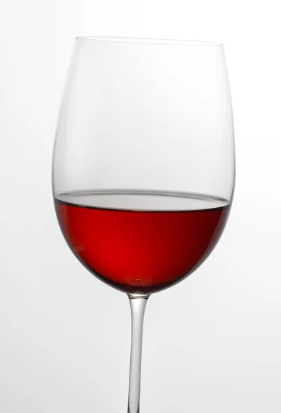 Glass half full of red wine — Stock Photo, Image