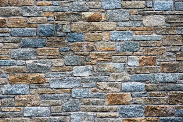 Fondo arquitectónico de un muro de piedra —  Fotos de Stock