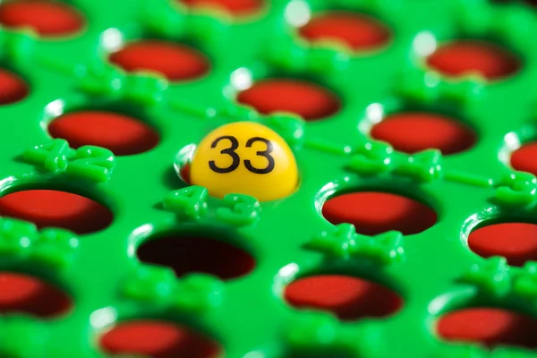 Número único - 33 - em uma placa de bingo — Fotografia de Stock