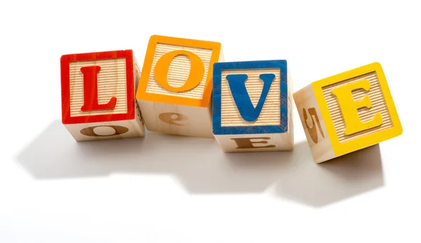 Love in Wooden Letter Blocks on White Background — Stock Photo, Image