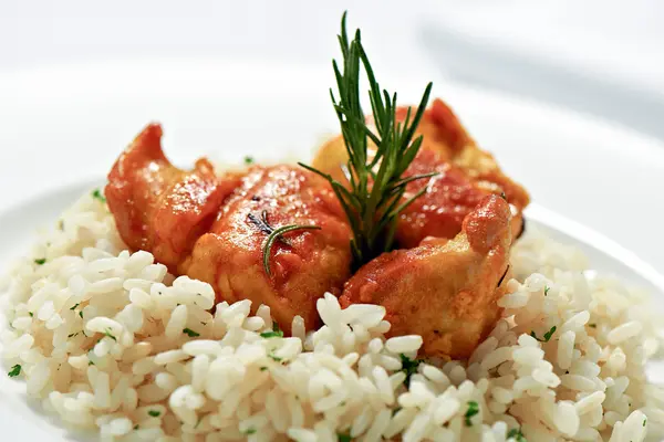 Portion of grilled or roast rabbit on rice — Stock Photo, Image