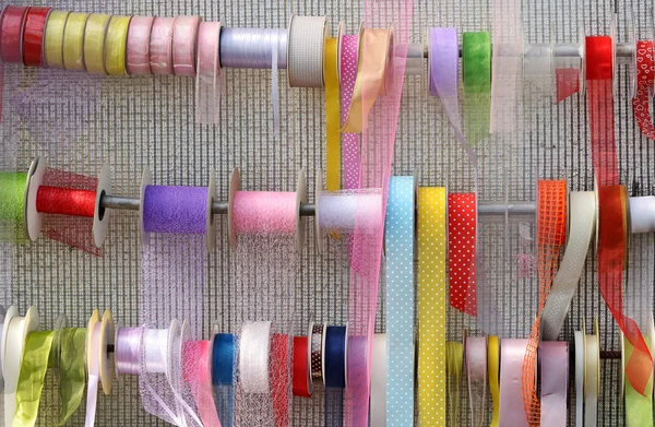 Decorative ribbons displayed on rails — Stock Photo, Image