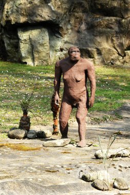 Australopithecus Afarensis Statue at Rocky Ground clipart