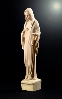 Statue of the Virgin Mary on black