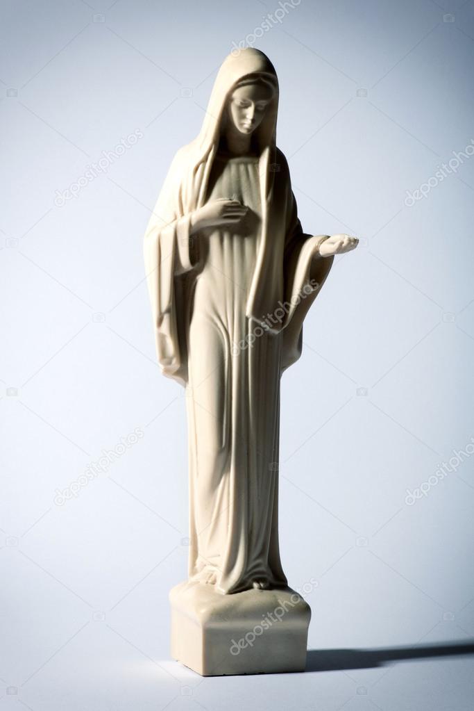 Statue of the Virgin Mary on grey