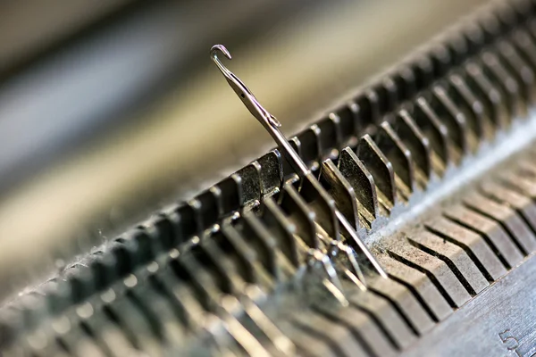 Knitting machine needle closeup — Stock Photo, Image