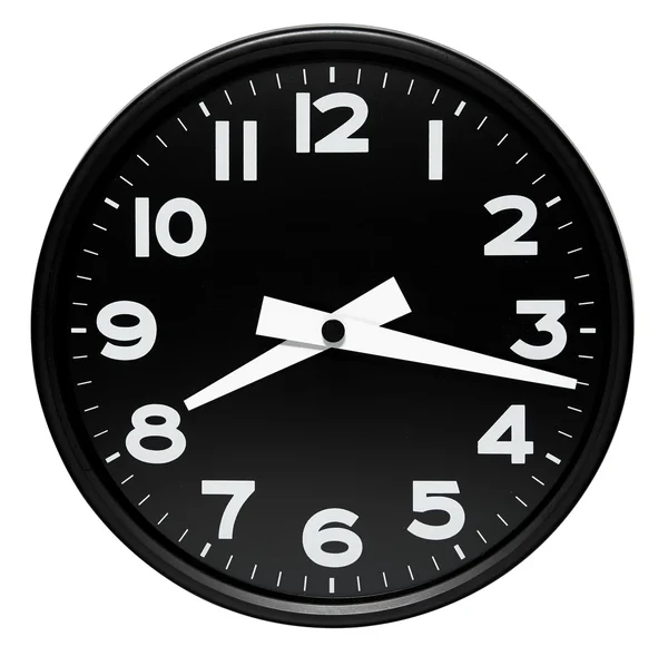 Round black wall clock over white — Stock Photo, Image