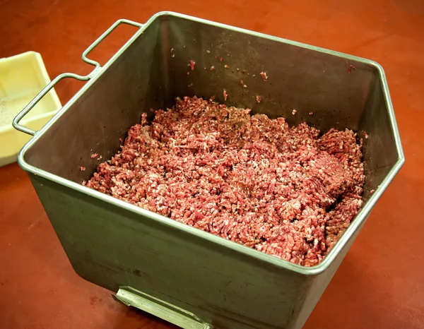 Bucket of salami meat in on the ground — Stock Photo, Image