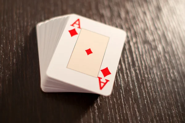 Deck of playing cards showing the ace of diamonds