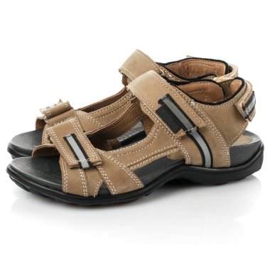 Beyaz arka planda izole edilmiş kahverengi bebek ayakkabıları. Yan görünüm.