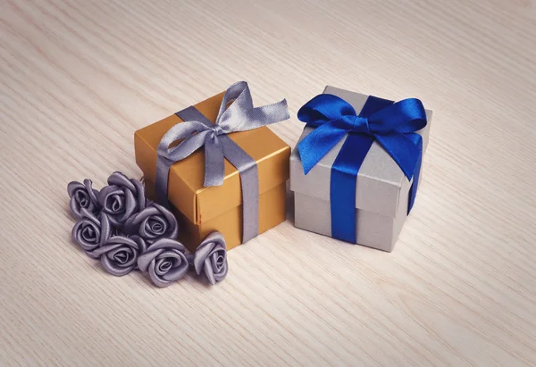 Grey flowers and gift boxes — Stock Photo, Image