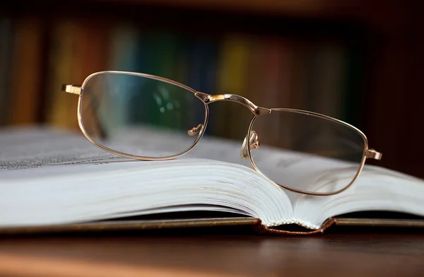 Glasses on open book — Stock Photo, Image