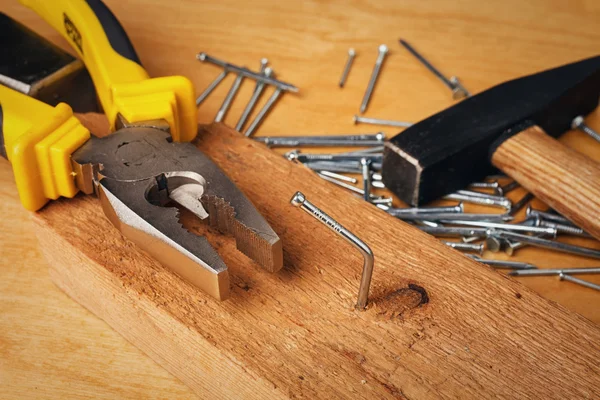 Pliers and nail — Stock Photo, Image