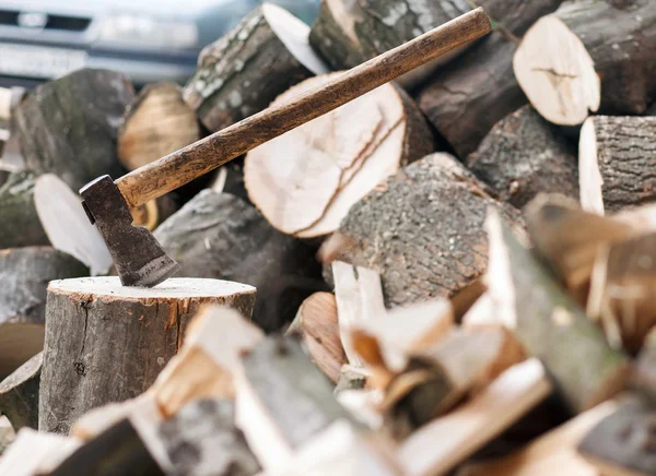 Axe stuck in a stump — Stock Photo, Image