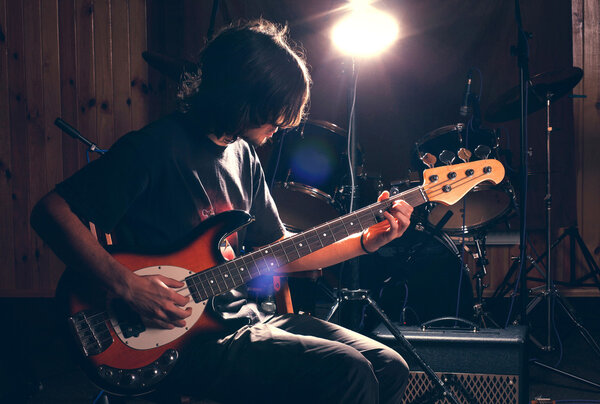 guy playing bass guitar