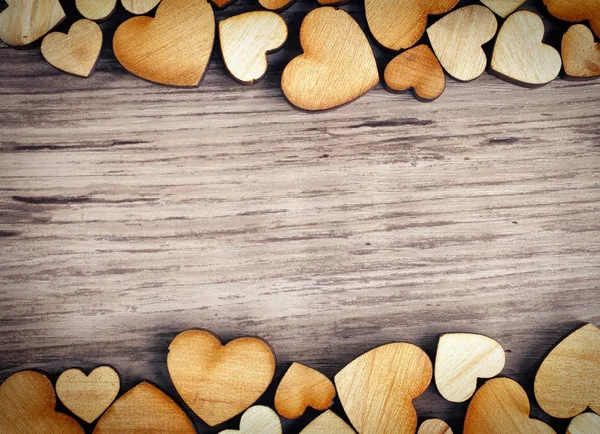 Sfondo con cuori di legno — Foto Stock