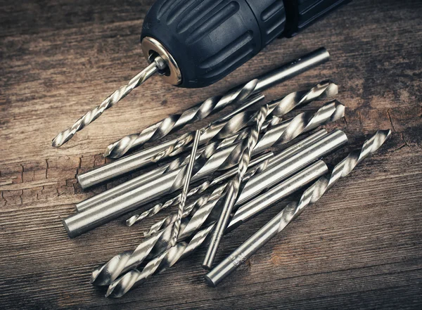 Drill and set of drill bits — Stock Photo, Image