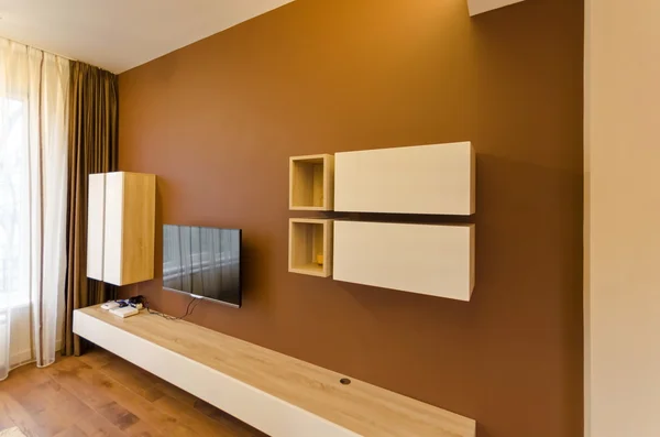 Wall in living room with cupboard and TV — Stock Photo, Image