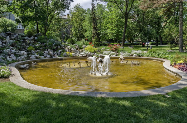 Group from small water fountains flowing in front beauty rockery