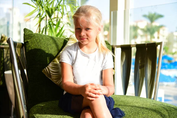 Young Girl Dress Sits Easy Chair Sunny Hotel Stock Photo