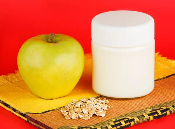 Jar with yogurt isolated on red background. — Stock Photo, Image