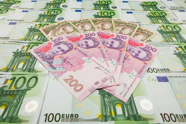 Paper money euro and hryvnia — Stock Photo, Image