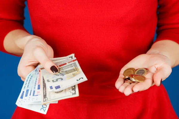 Euro and coins in the hands of a girl — Stock Photo, Image