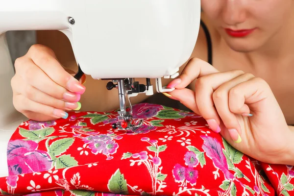 Seamstress sew fabric on the sewing machine. — Stok fotoğraf