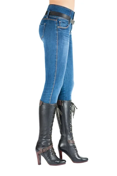 Legs in jeans and boots belongs to beautiful girl. — Stock Photo, Image