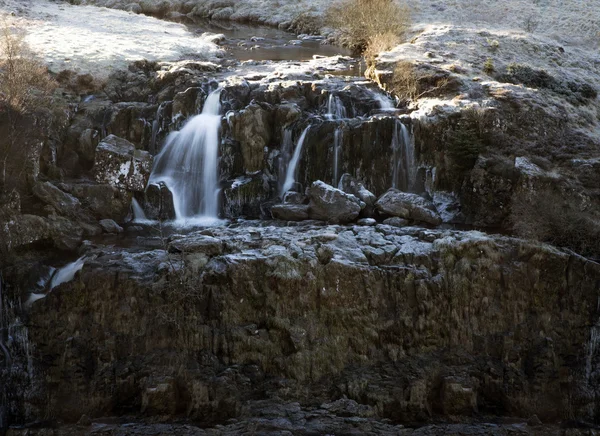 Distant view of water cascading over the Loup Fintry Waterfall — Stock Photo, Image