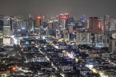 Kuala Lumpur, Malaysia . August 02, 2024: Nighttime cityscape showcases urban skyline filled with bright lights and bustling streets.
