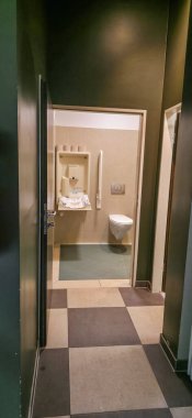 Berlin, Germany - July 21, 2025: . Clean restroom hallway features modern fixtures and a stylish tiled floor