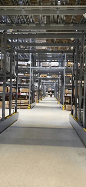 Interior view of warehouse showcasing organized shelves and clear pathways for storage efficiency.