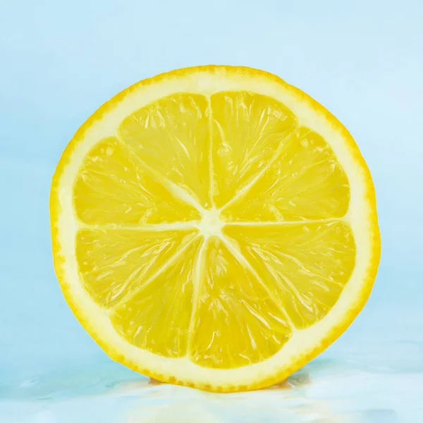 One natural lemon isolated on white background.