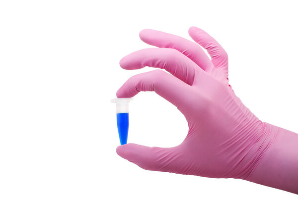 Hand in gloves keeps plastic tube with blue fluid