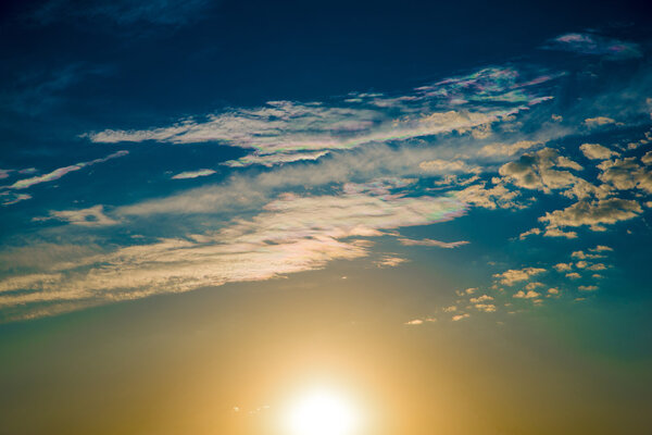 Iridescent clouds at sunset.