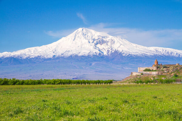 Khor Virap monastery in front of Mount Ararat viewed from Yerevan, Armenia. This snow-capped dormant compound volcano described in the Bible as the resting place of Noah's Ark.