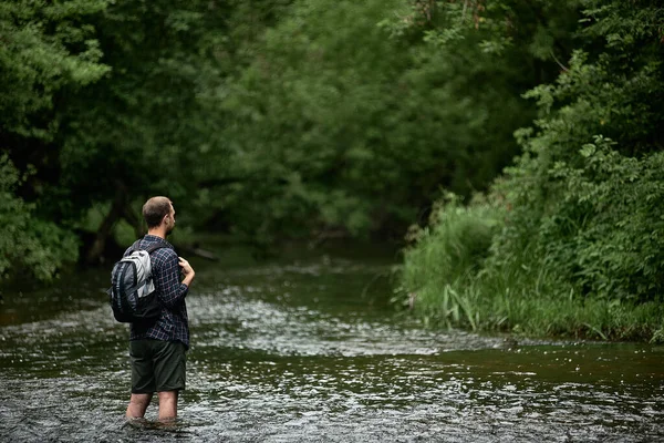 Back View Hiker Plaid Shirt Backpack Crossing River Enjoying Nature — Stock Photo, Image