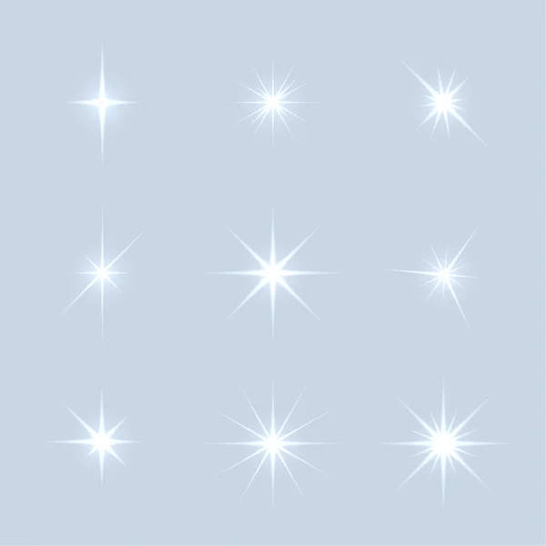 Conjunto vetorial de estrelas de luzes cintilantes . —  Vetores de Stock
