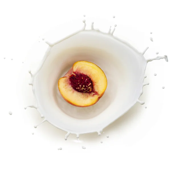 Peach in milk splash — Stock Photo, Image